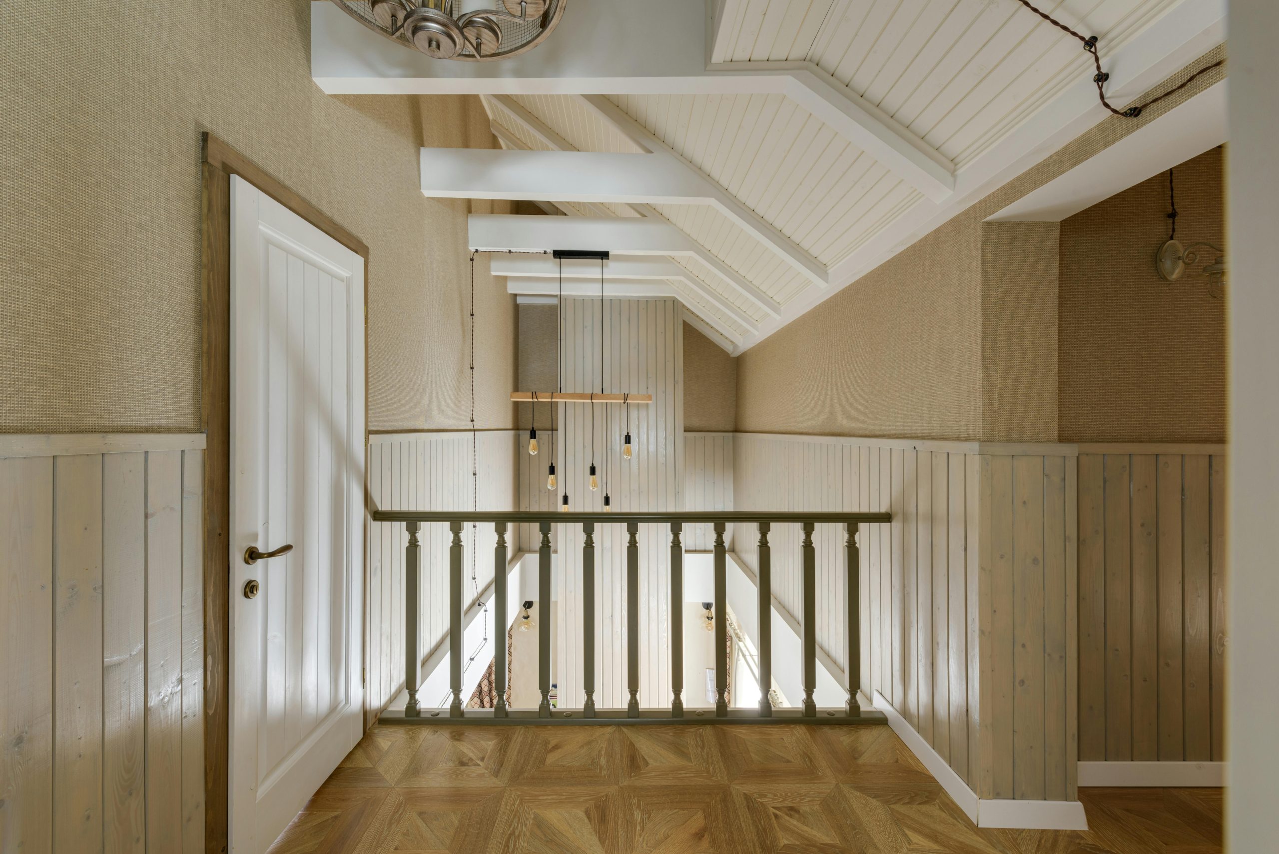 A beautifully designed interior showcasing wooden paneling and modern lighting in a hallway.