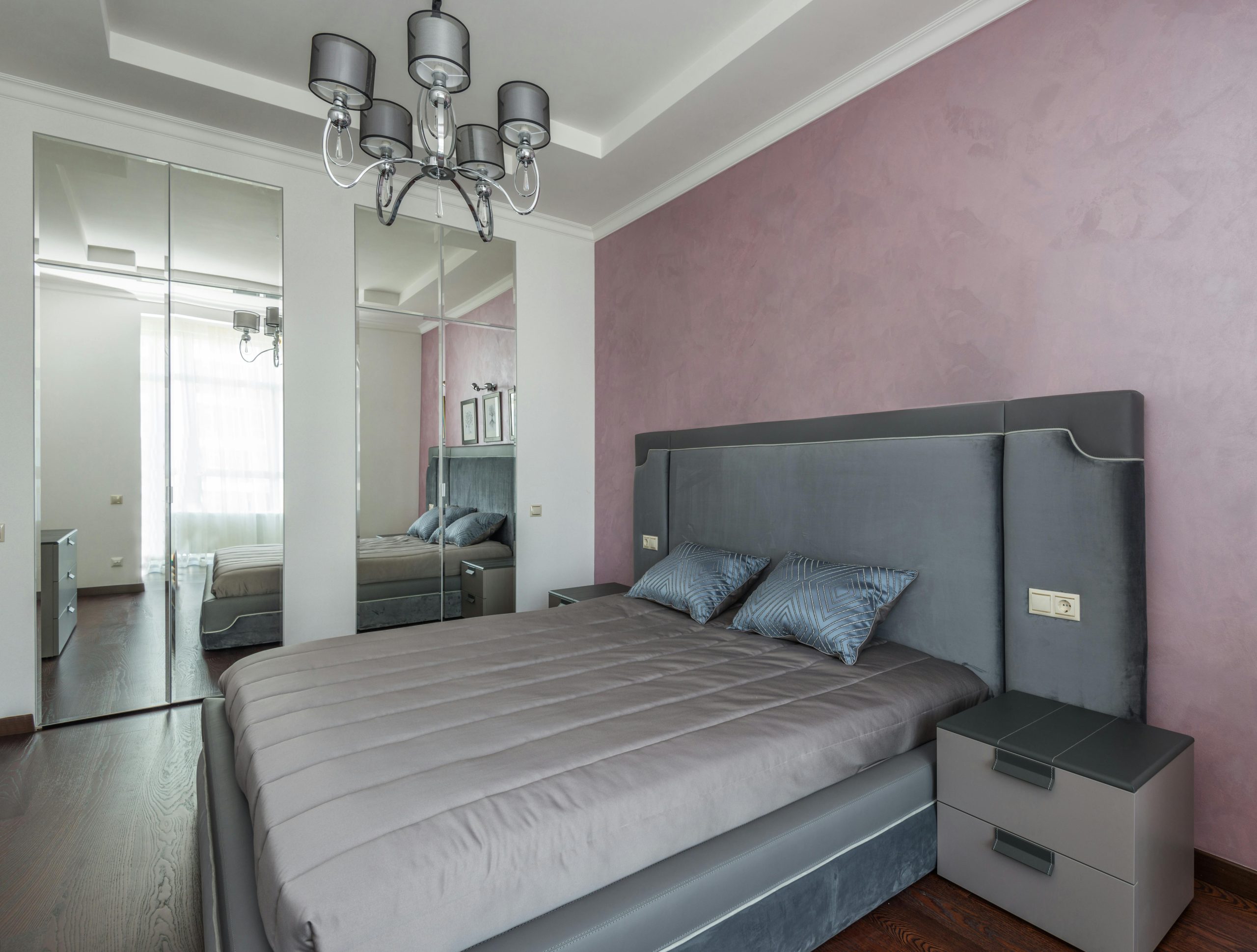 Contemporary bedroom interior design featuring elegant furnishings and a soft color palette.