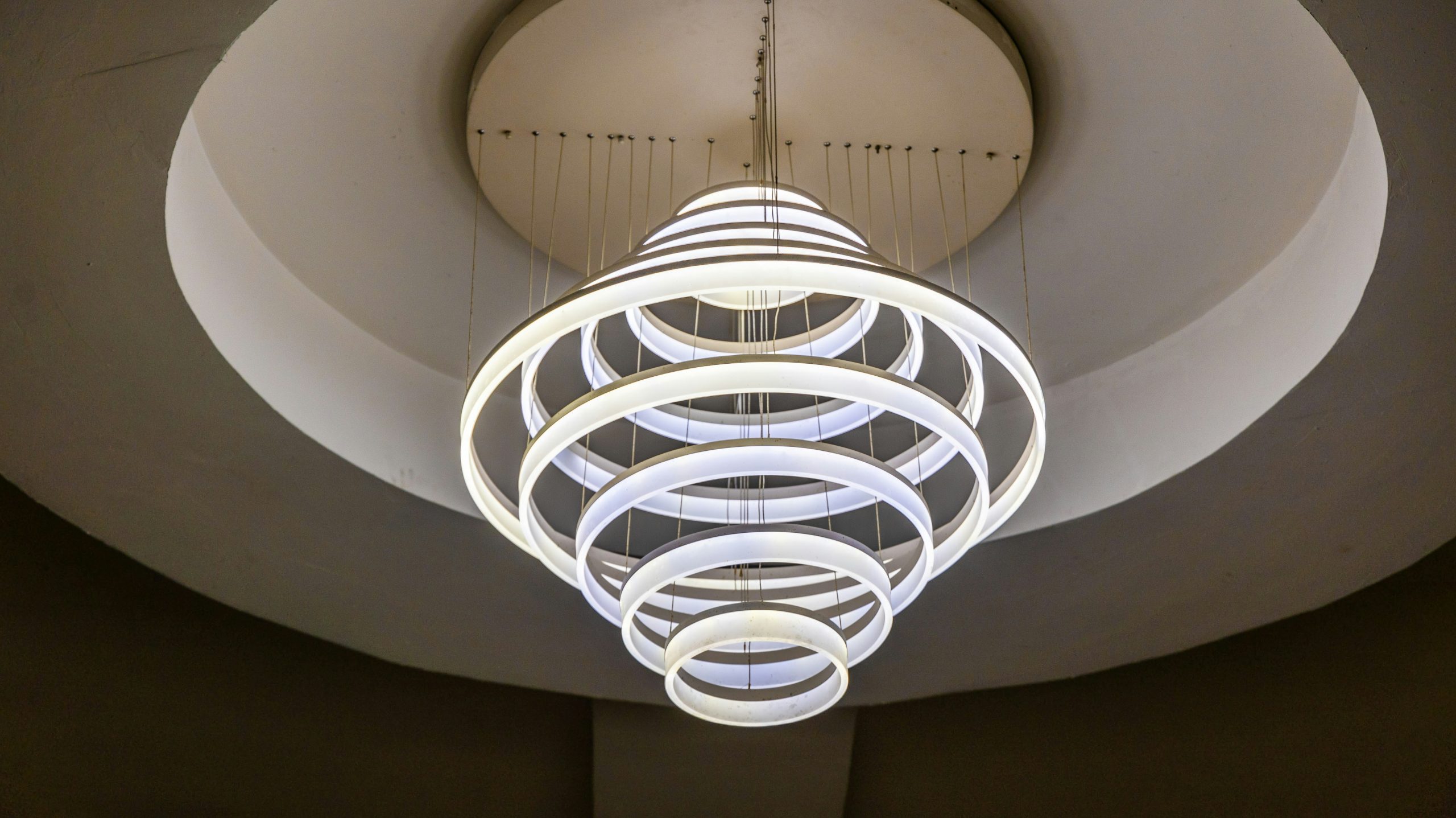 a circular light fixture hanging from the ceiling