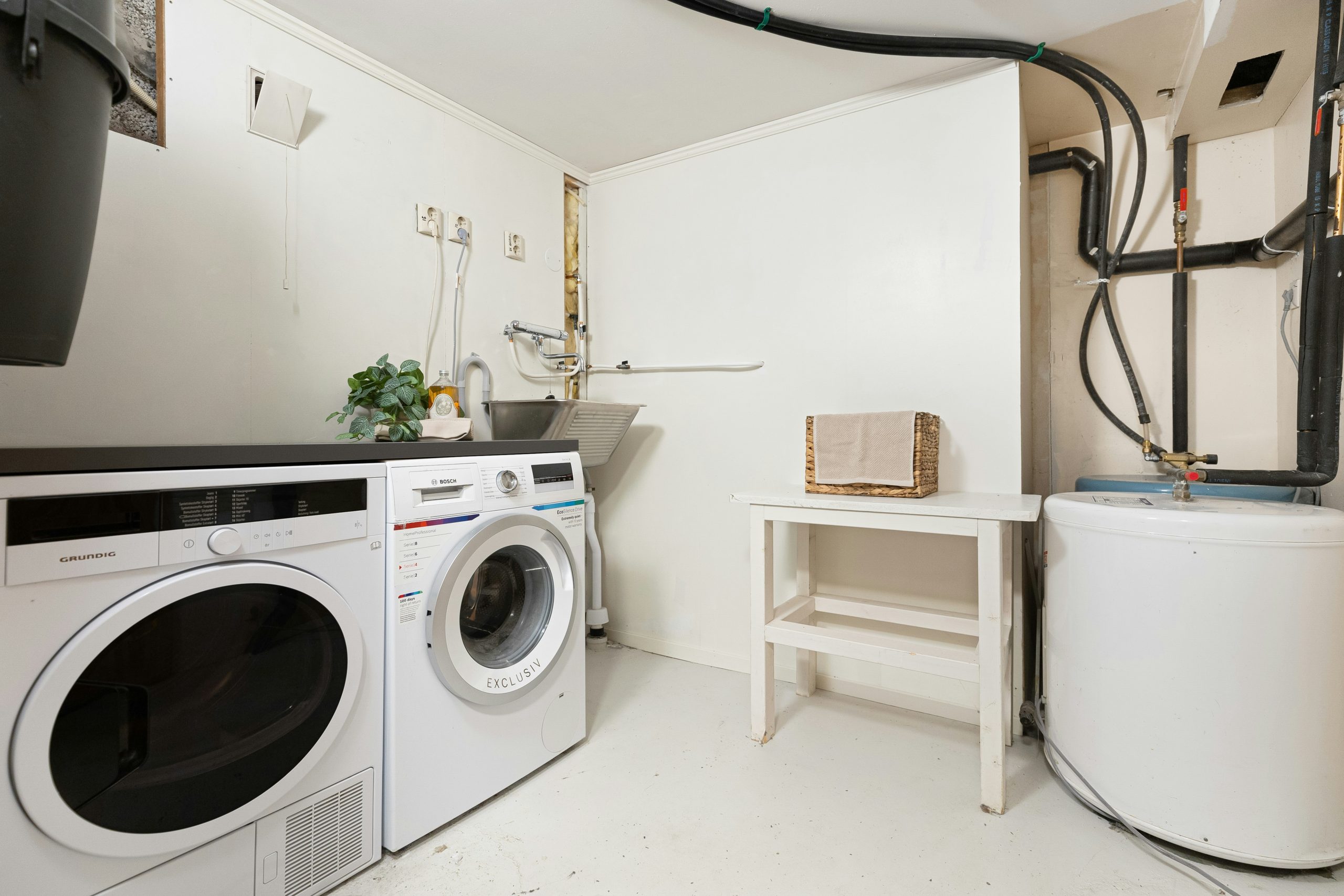 A laundry room with a washer and dryer