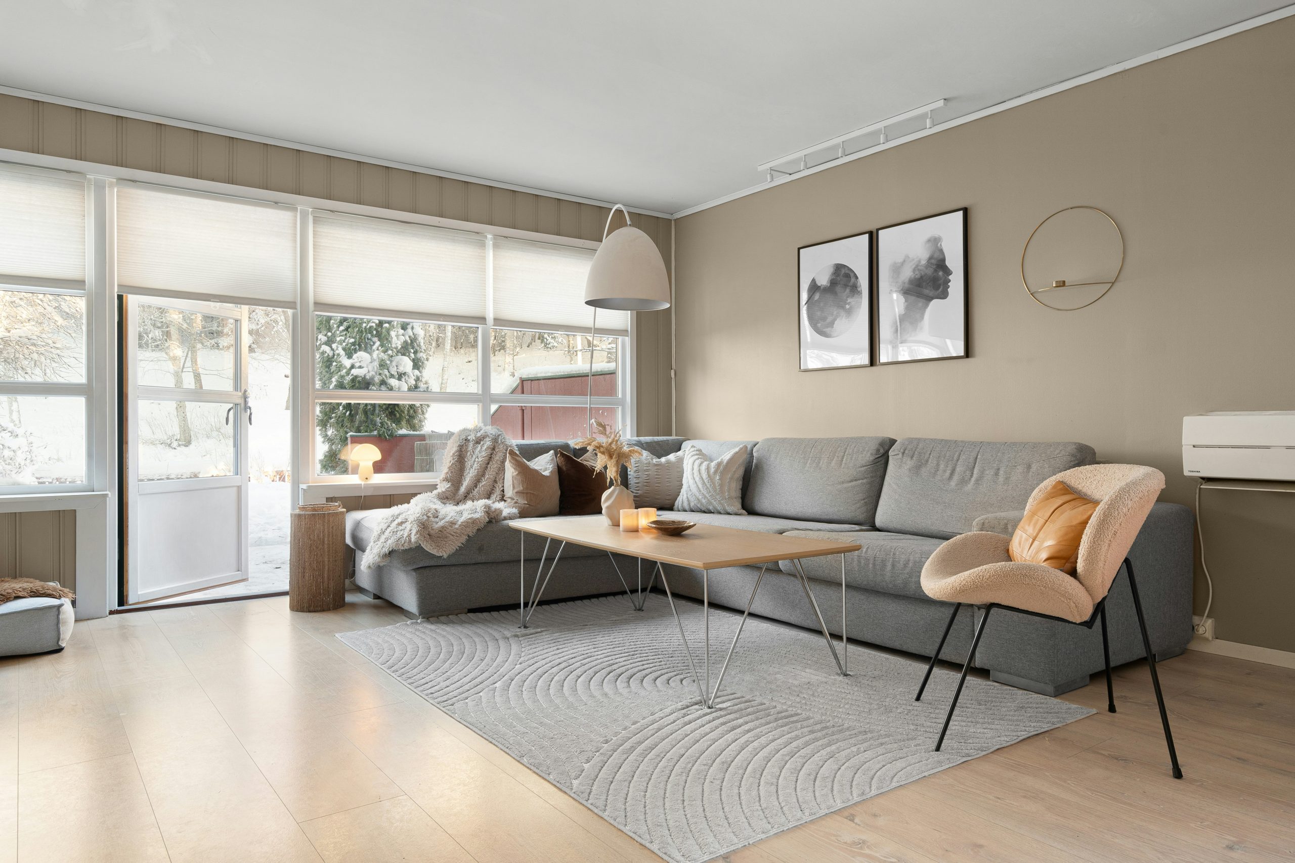A living room filled with furniture and a flat screen TV