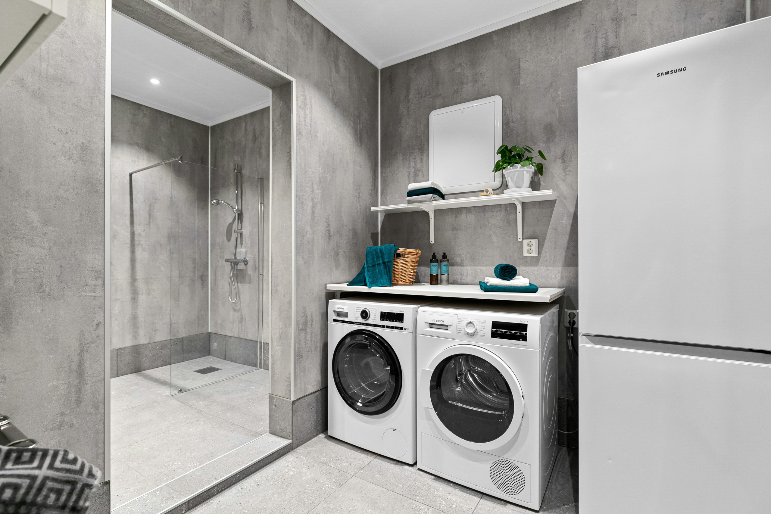 A washer and dryer in a small room