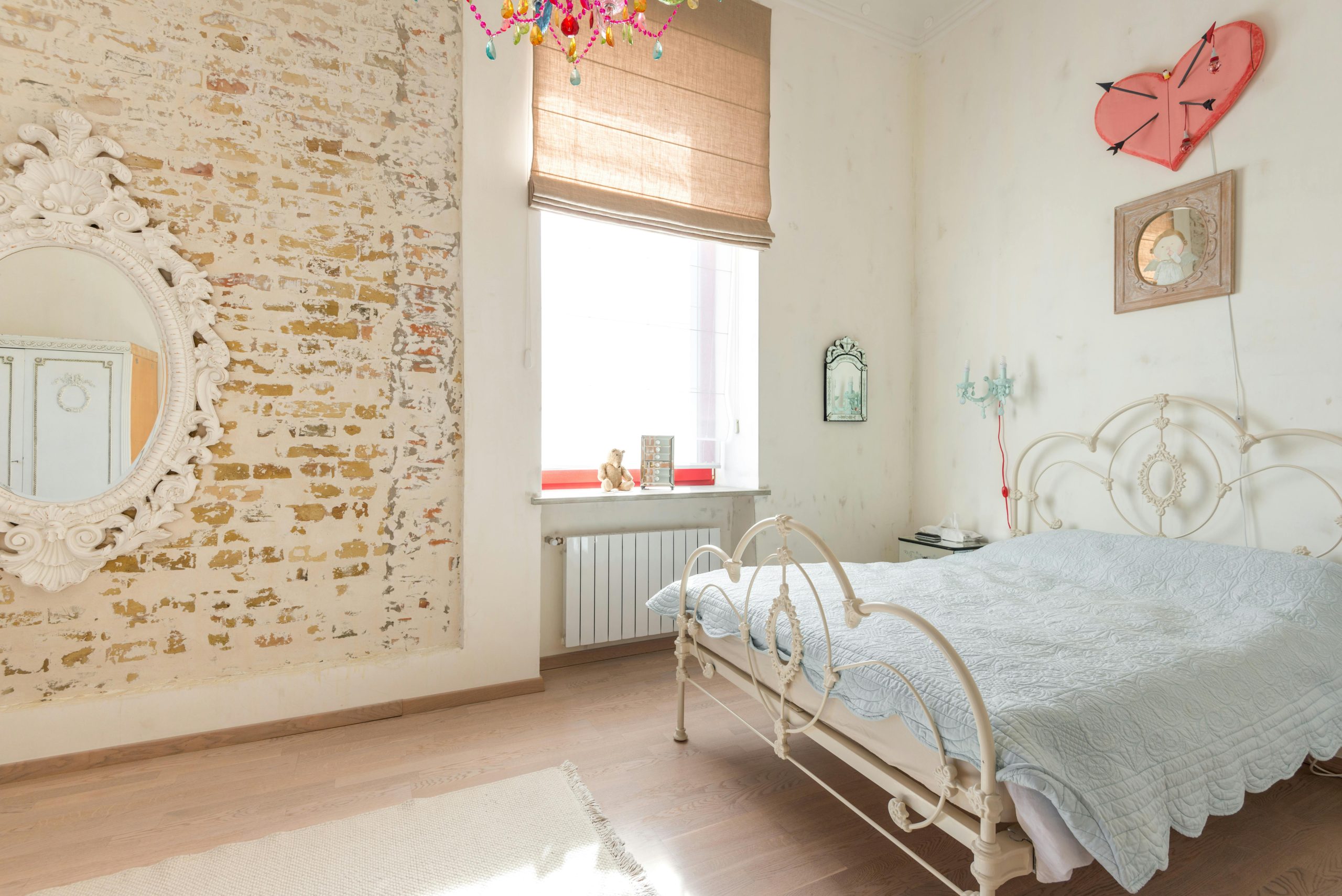 Charming bedroom featuring vintage-style furniture, rustic decor, and a bright, cozy atmosphere.