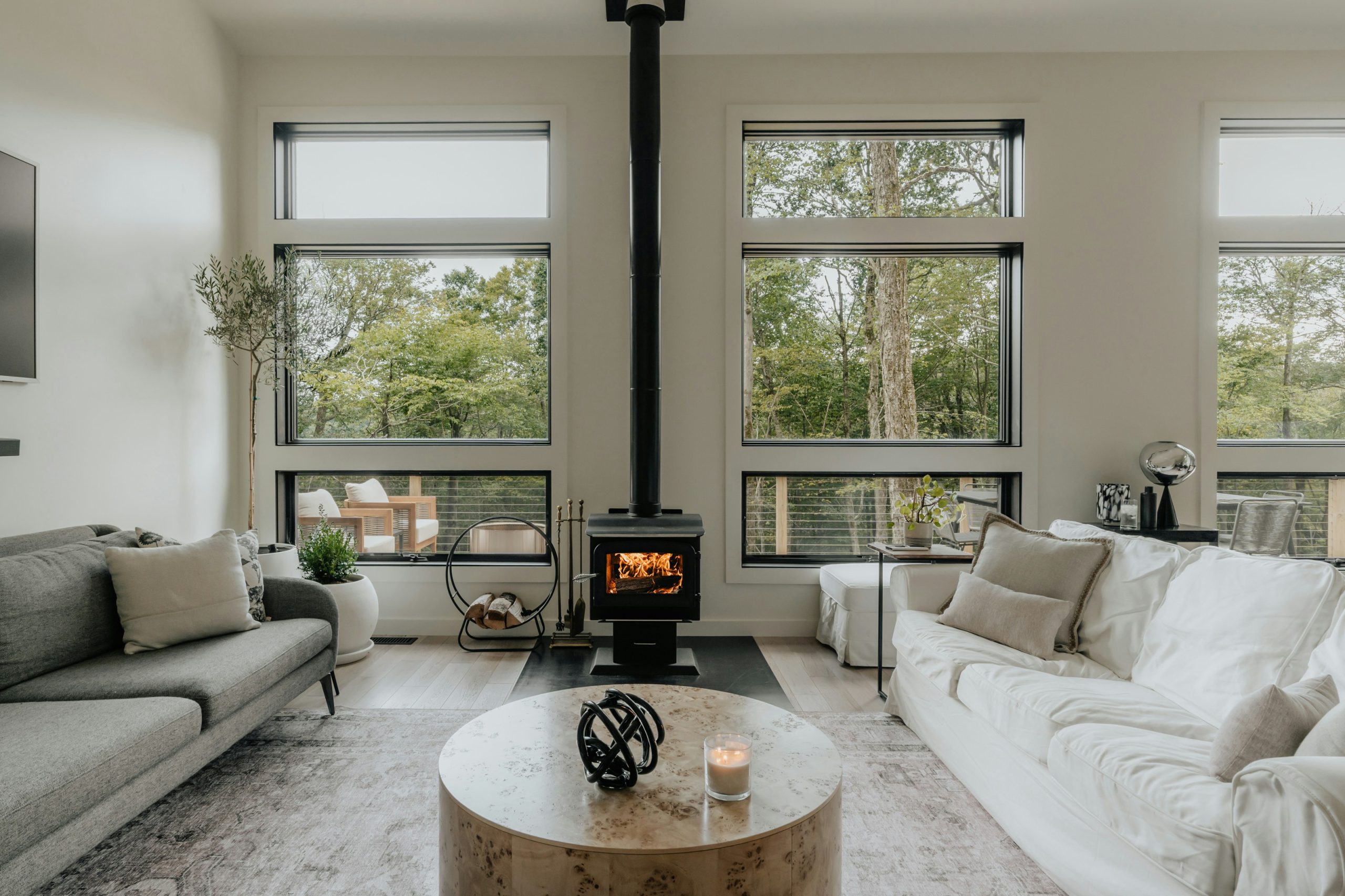 Modern living room with wood stove (IG: @clay.banks)