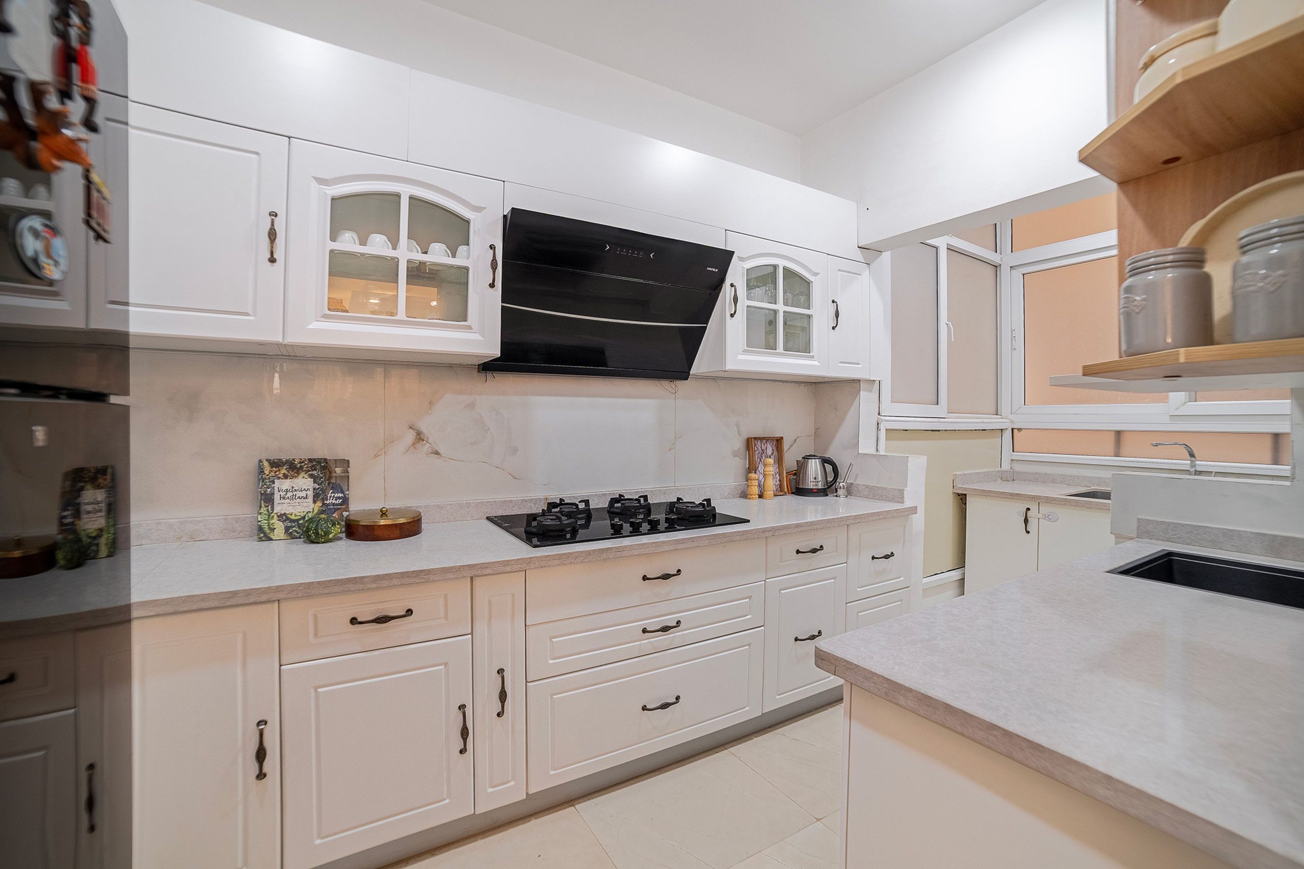Parallel Kitchen Design with Classic Off-White Cabinets and Quartz Countertop | Livspace