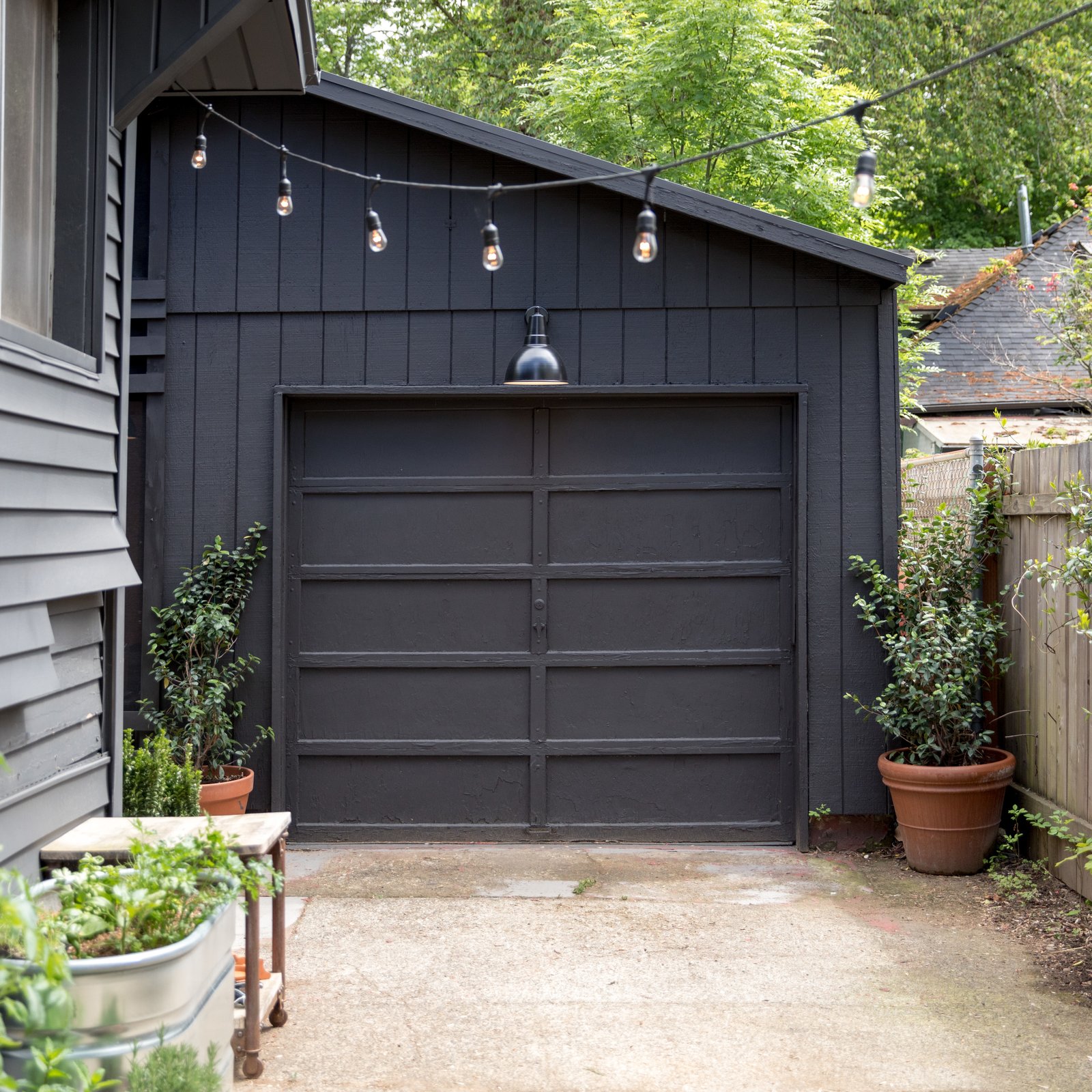 Photo 7 of 14 in 15 Modern Garage Doors That Demand a Second Look from Budget Breakdown: A Weekend DIY Turns a Neglected Garage Into a Backyard Hangout for $13K - Dwell