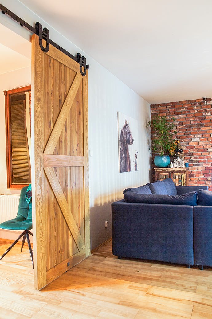 Rustic wooden door in modern interior | RENO doors | RENO doors