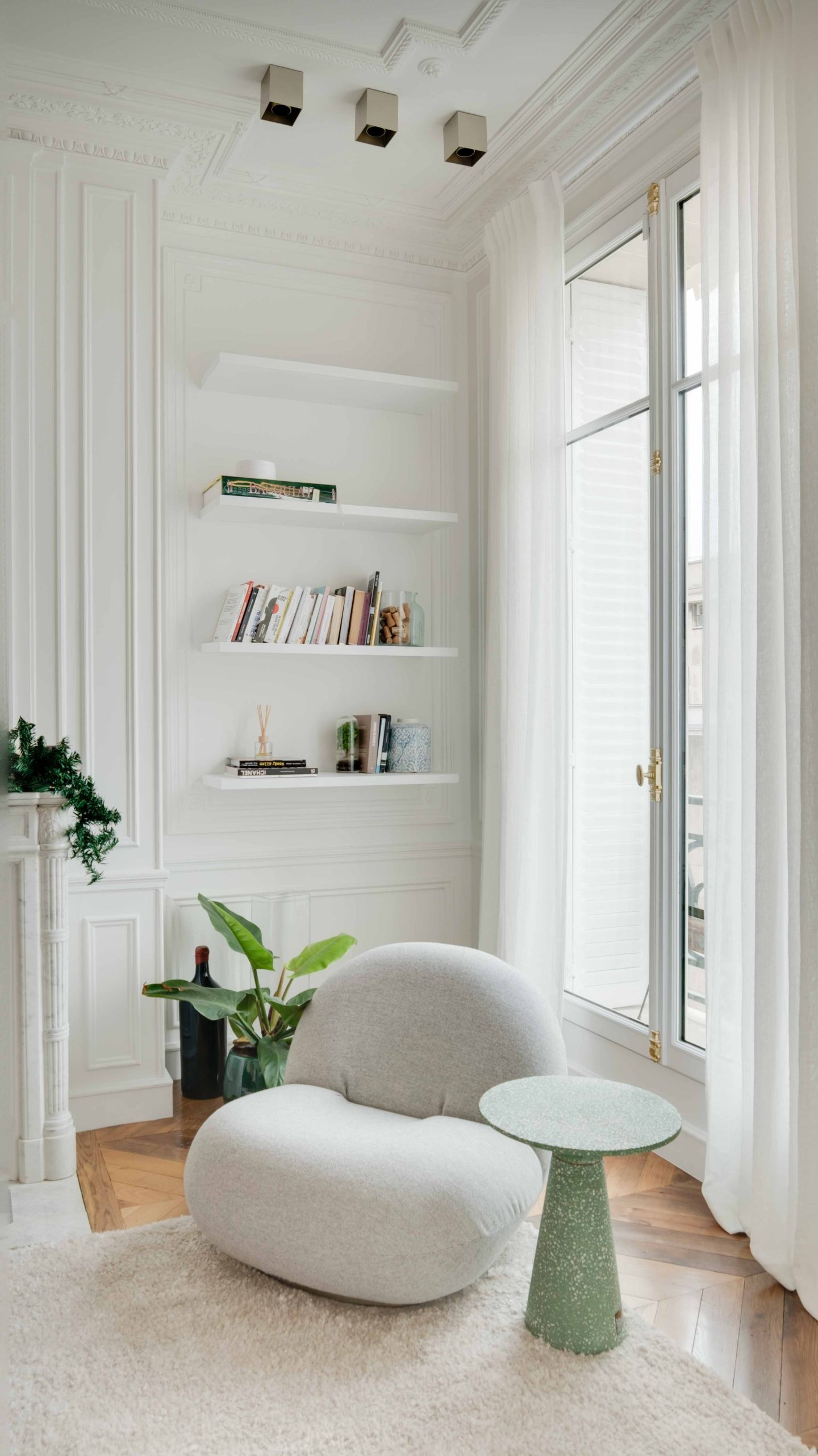 Sophisticated white living room with modern furniture and decor.