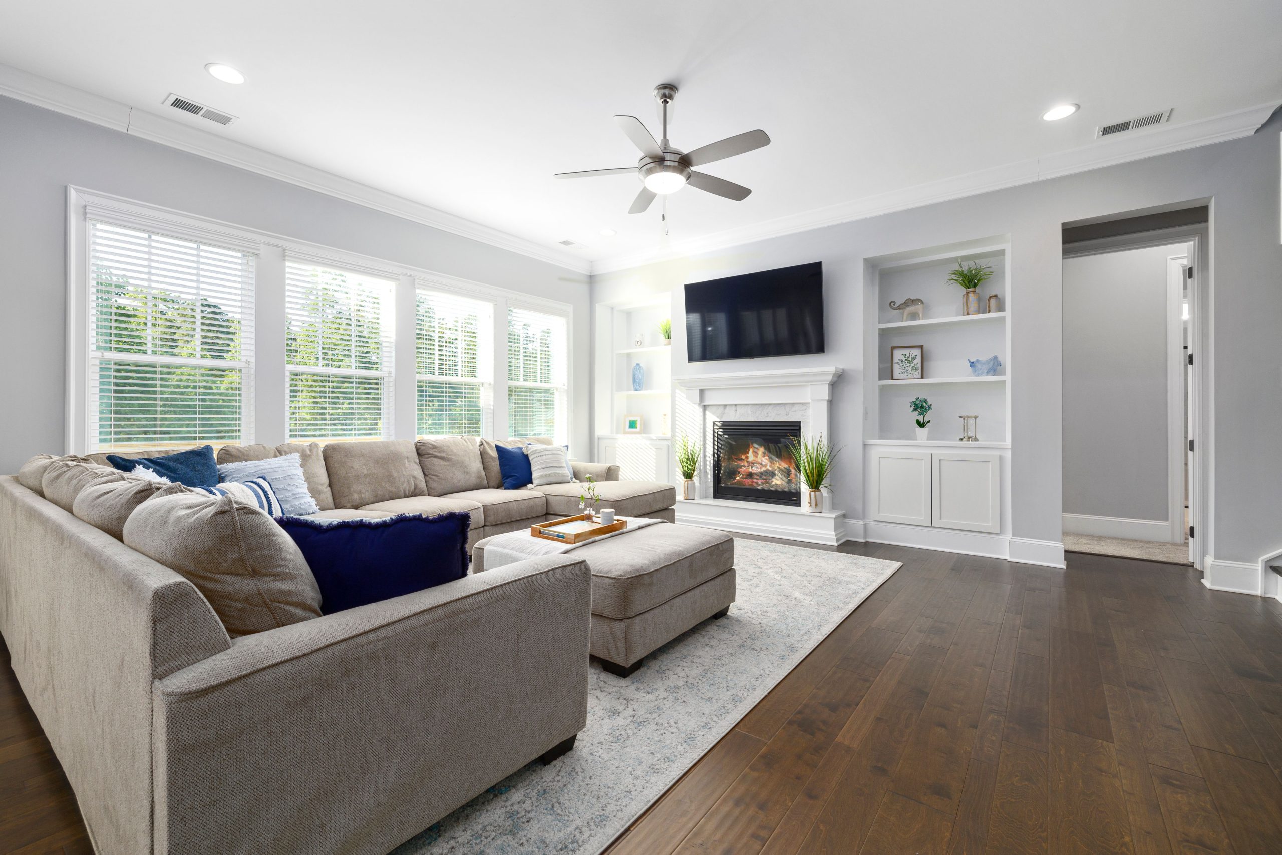 Spacious living room featuring neutral tones, cozy sofa, and elegant decor for a modern home feel.