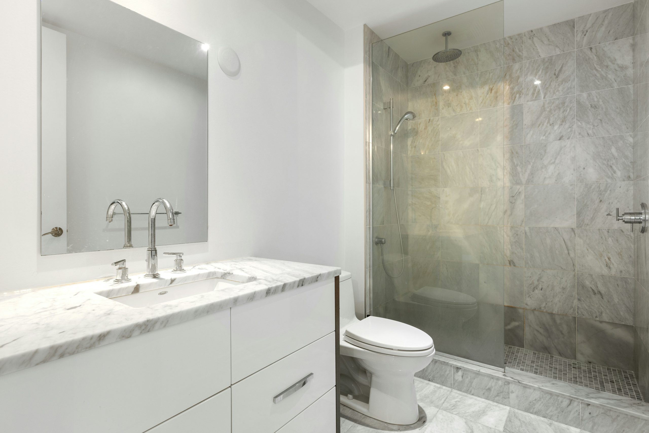 a bathroom with a glass shower