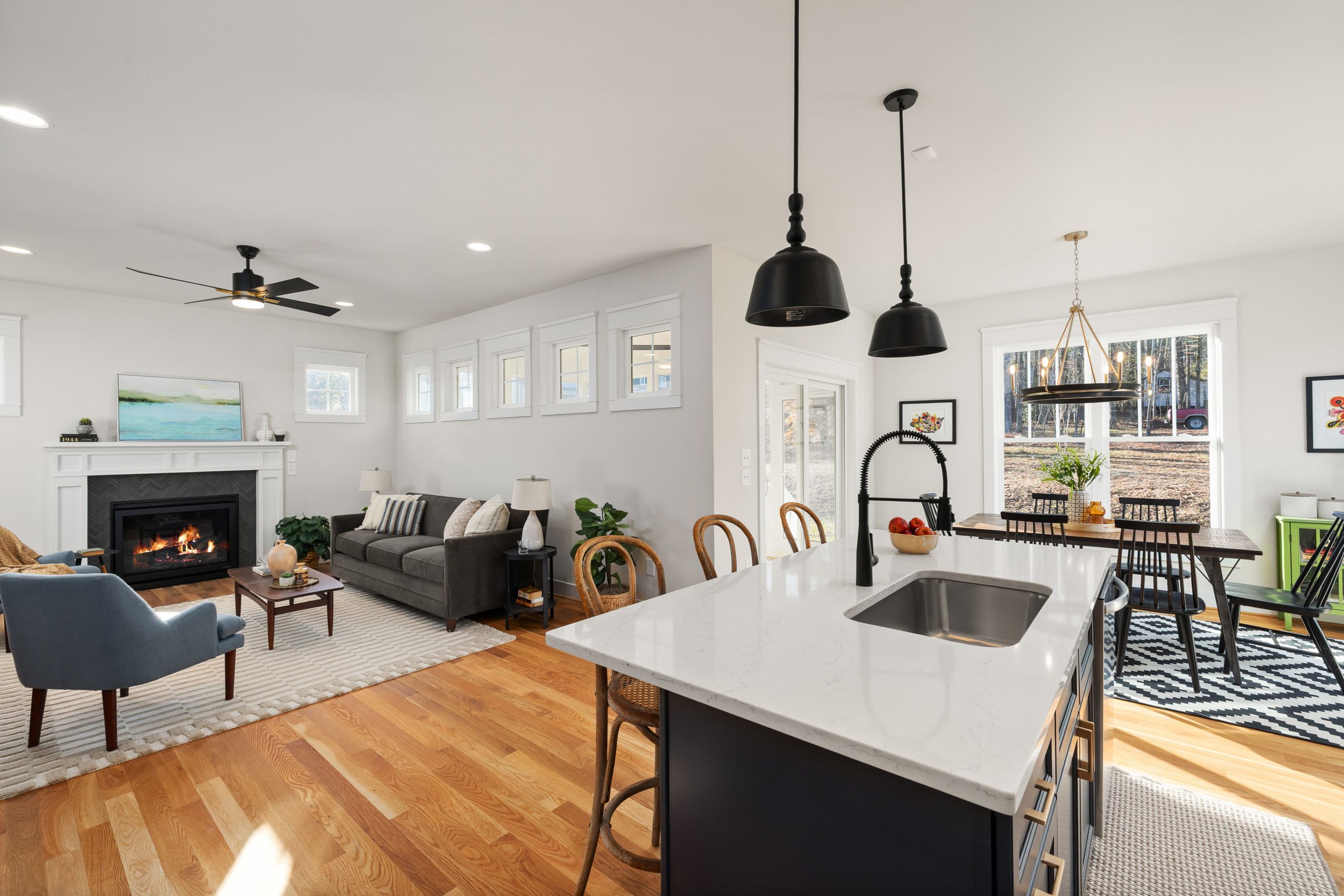 Bright open-concept living room and dining space featuring modern interior design.