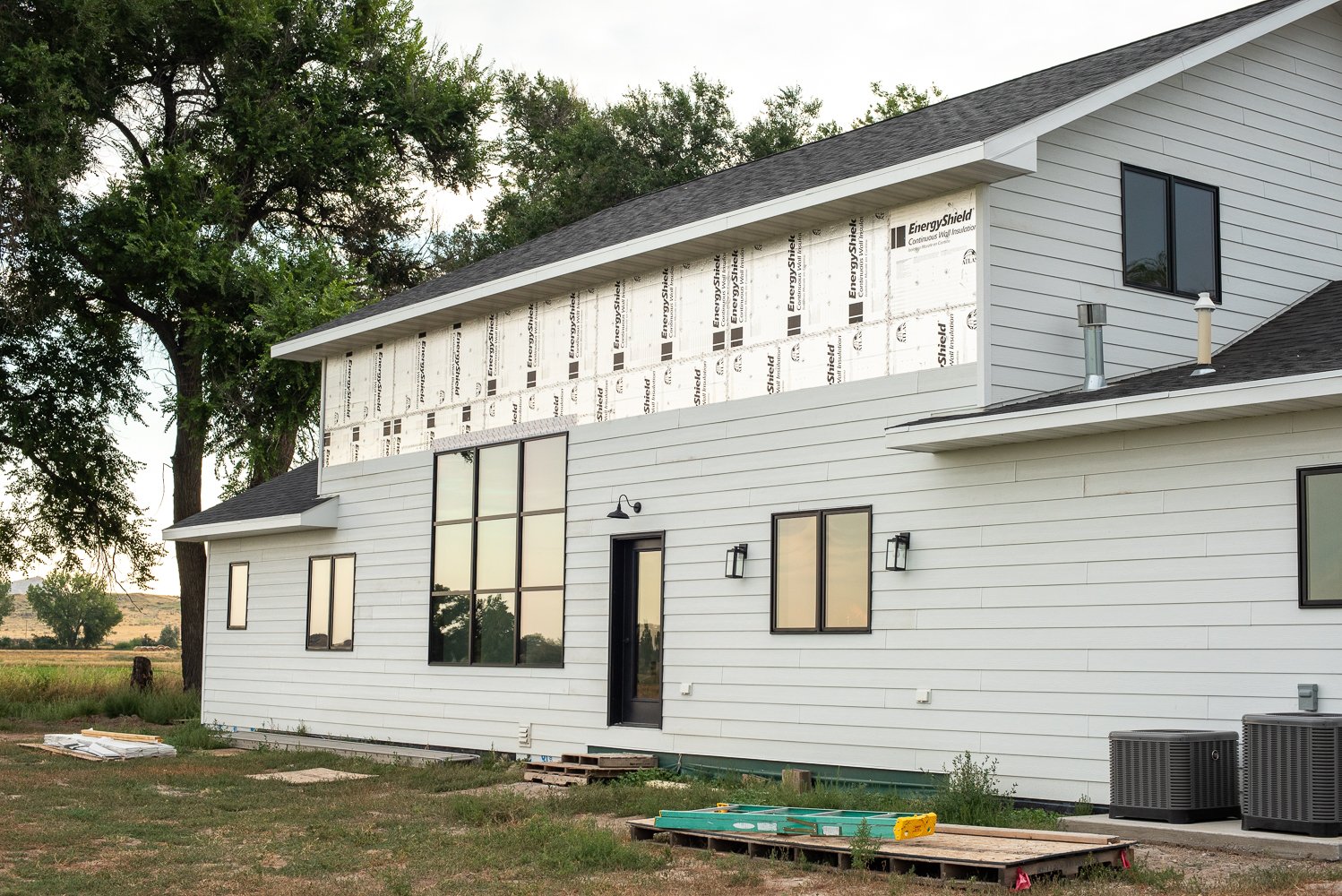 Farmhouse update featuring the kitchen, great room and exterior. — Whitney Out West