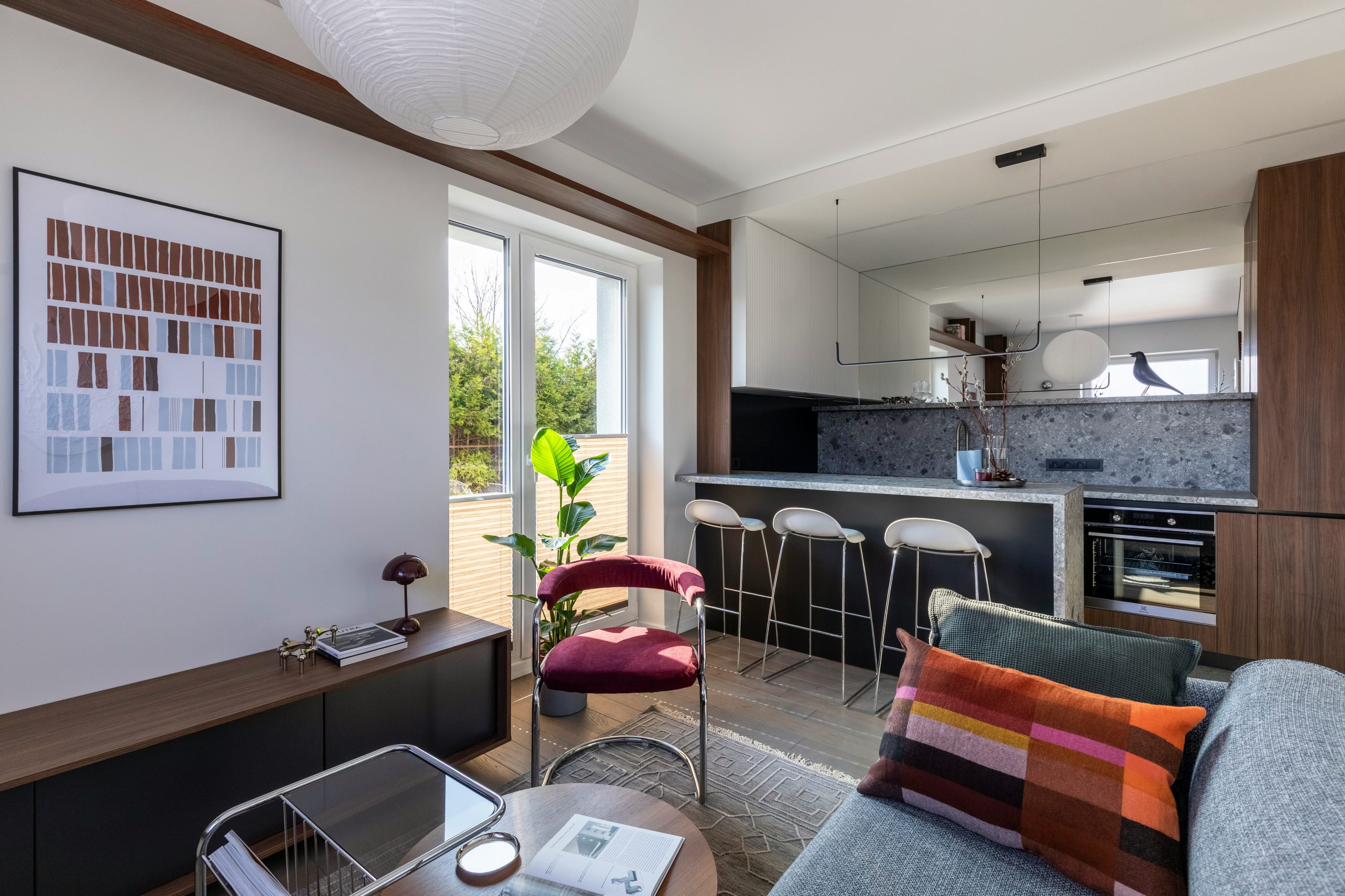 This 35 m² apartment in Vilnius is designed as a compact yet spatially fluid living environment, drawing on Mid-Century modern principles interpreted through a contemporary lens.